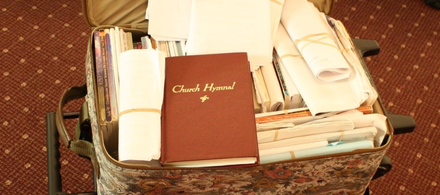Collection of Sacred Harp songbooks and a Church Hymnal, All items in a rolling suitcase